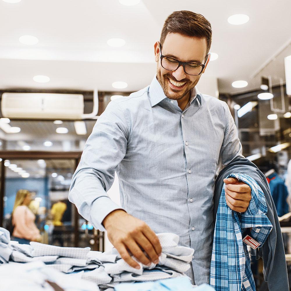 A man shopping in a retail clothing store