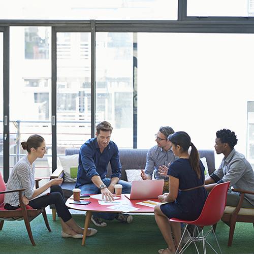 A group of business people meeting around a table.