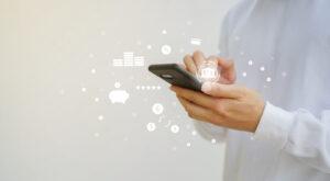 Close up of a man hand holding smartphone to access a banking application.