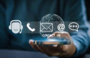 Human hand ues smartphone with call center on screen contact us, email, address, operator, customer, support, phone services agen, c