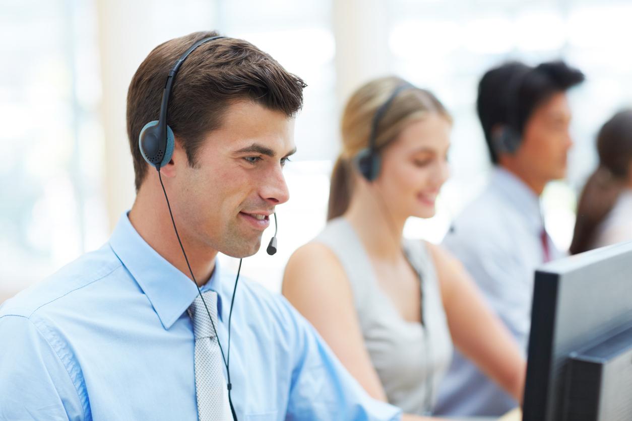 Contact center with agents handling customer call.