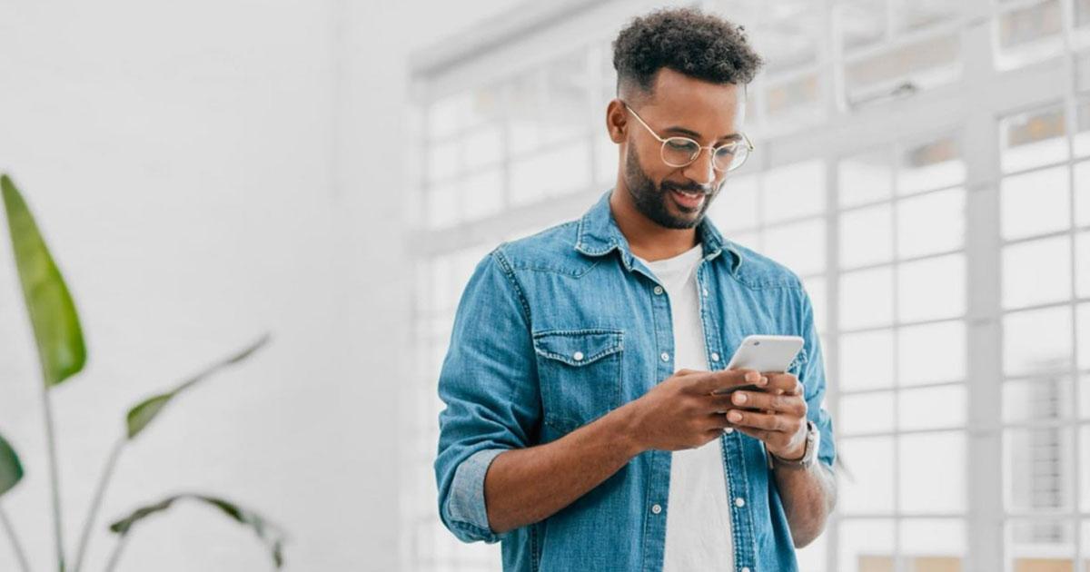 A man on his phone as part of the end-to-end customer experience