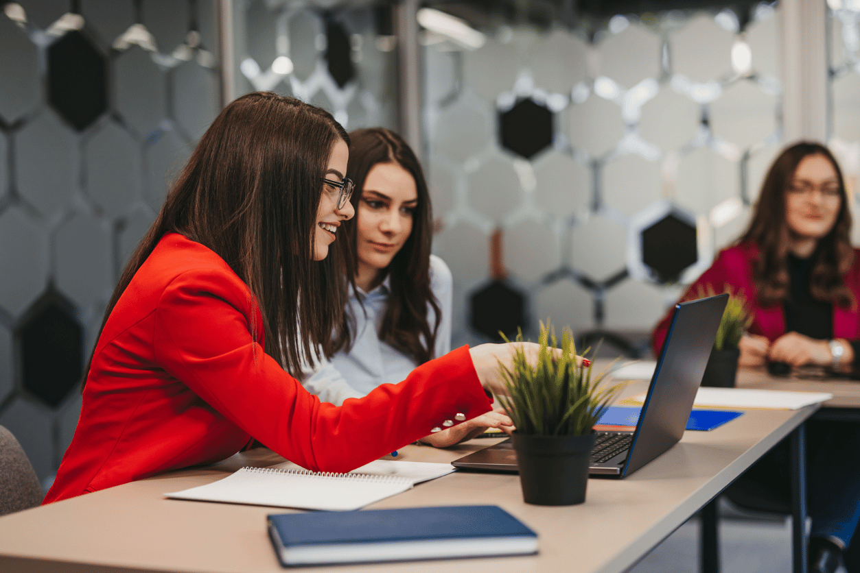 Metro Bank + Pearl-Plaza: image of two women sitting at a desk looking at a computer in an office setting