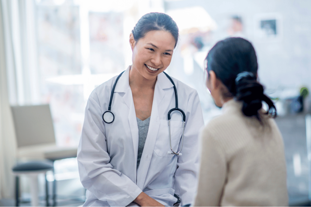 St. Luke's Medical Centers + Pearl-Plaza: image of female doctor greeting woman in a clinical setting